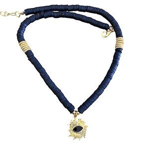 Black natural disc choker necklace w/ gold sunburst & accents adj closure